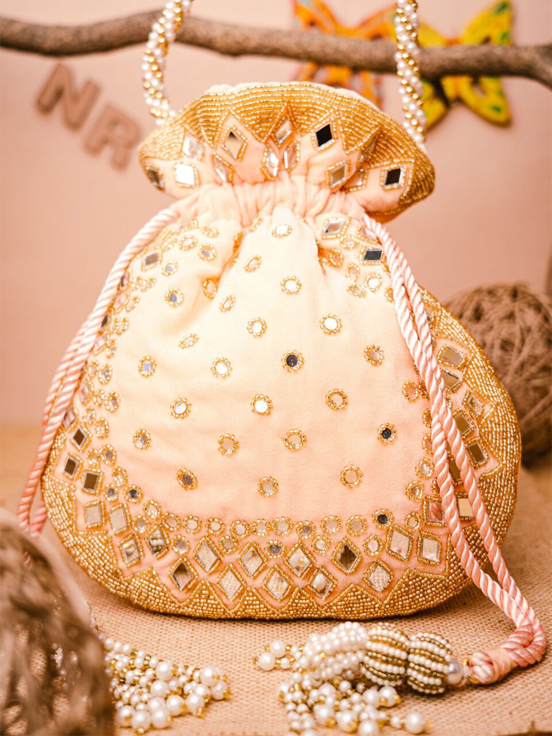 Dhiyona NR Women Peach-Coloured & Gold-Toned Embroidered Potli Clutch