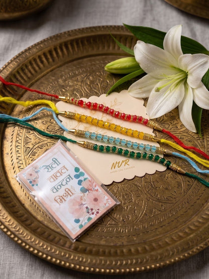 Dhiyona Set Of 4 Multicolor Artificial Beads Thread Rakhi With Roli Chawal Chandan Mishri