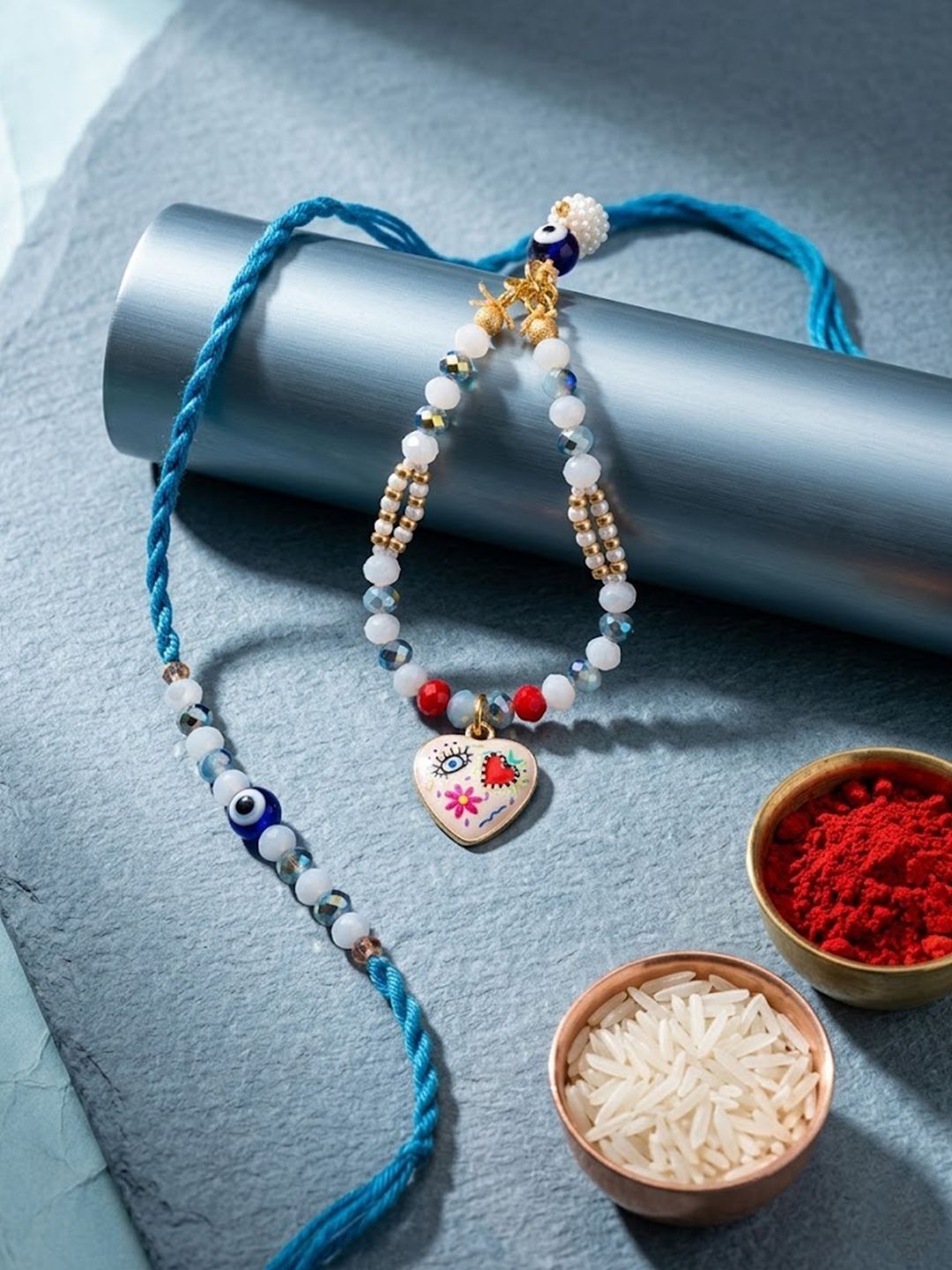 Dhiyona Set Of 2 Evil Eye Beaded Gold Toned Bhaiya Bhabhi Rakhi With Roli Chawal Chandan