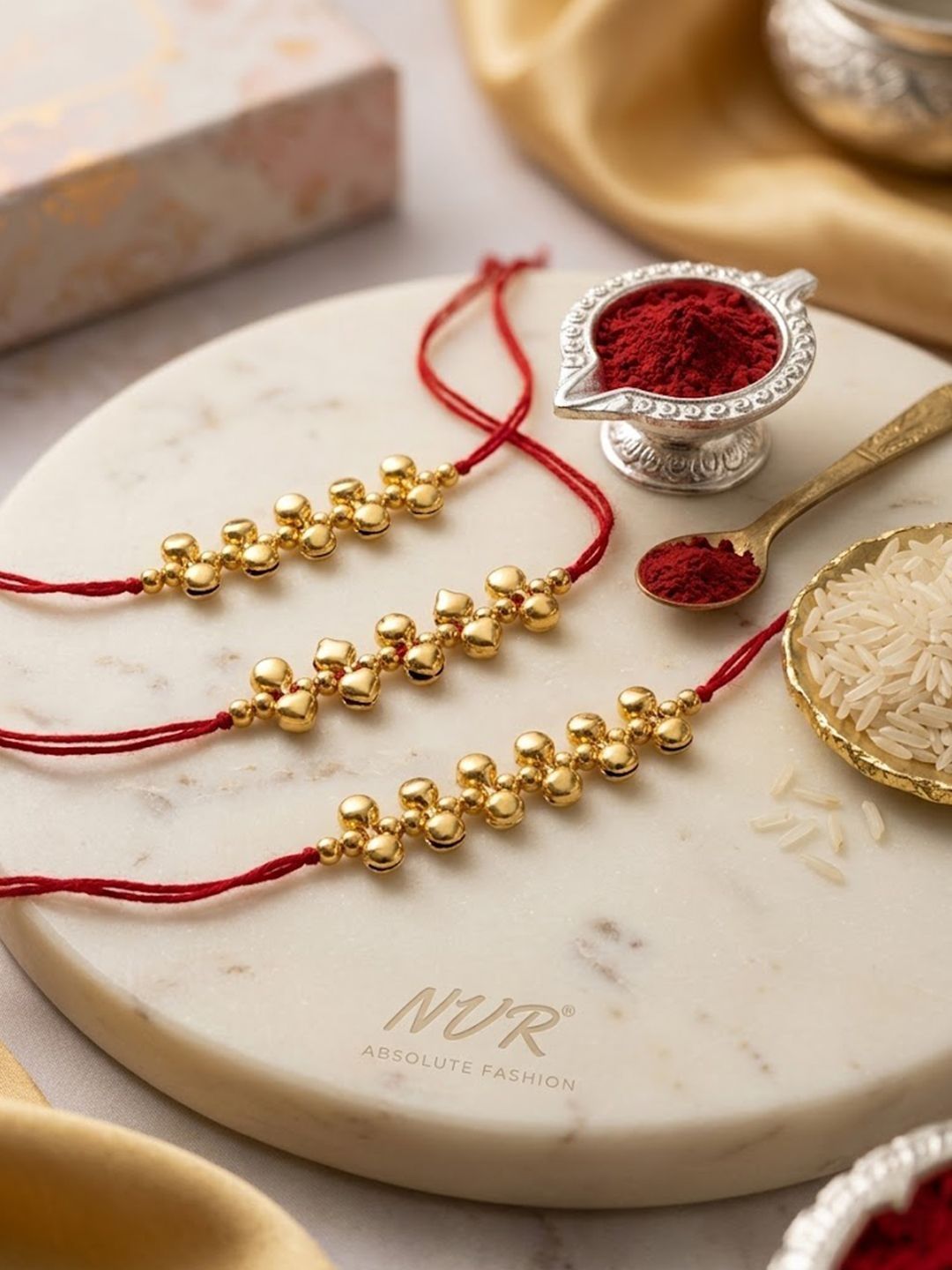 Dhiyona Set Of 3 Gold Toned Ghungroo & Red Thread Rakhi With Roli Chawal Chandan Mishri