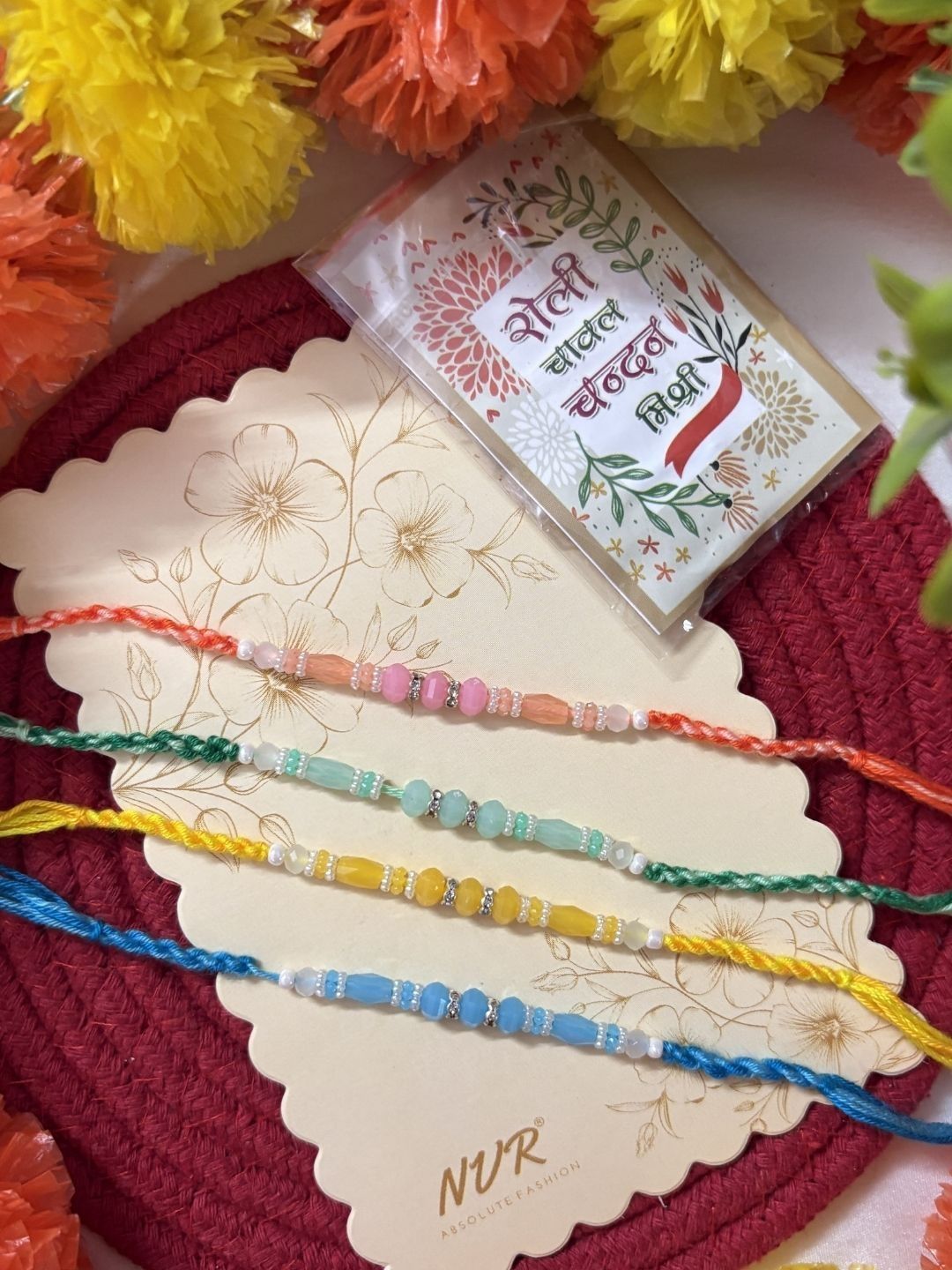 Dhiyona Set Of 4 Multicolor Artificial Beads Thread Rakhi With Roli Chawal Chandan Mishri