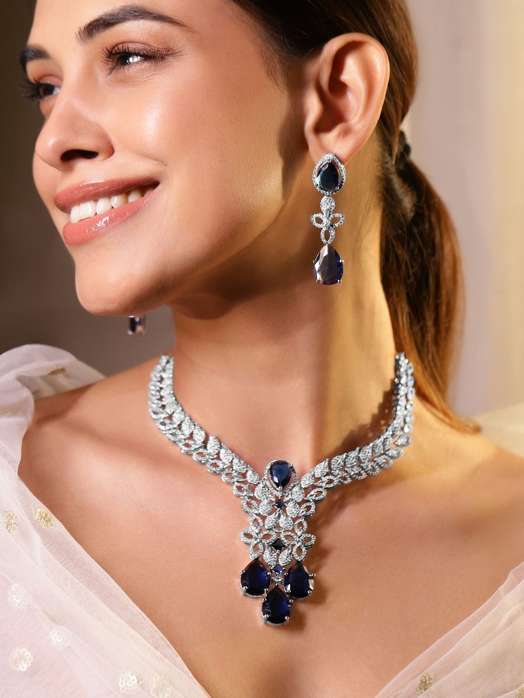 Dhiyona RJ Women's Rhodium Plated Blue Sapphire and Cubic Zirconia Studded Premium Jewellery Set