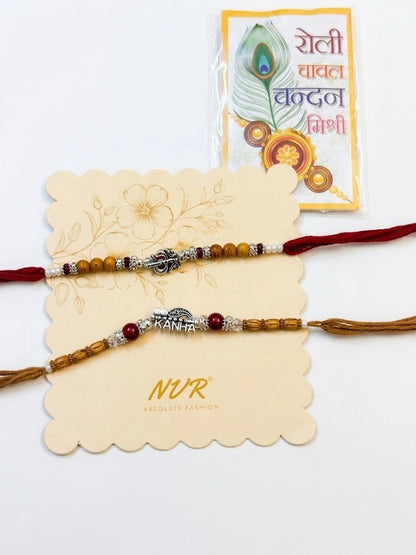 Dhiyona Set Of 2 Silver Toned Religious Rakhi Thread Rakhi Roli Chawal Chandan Mishri