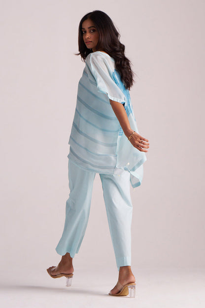 Woman wearing a Misty Blue Silk Kaftaan Co-ord Set on a plain background