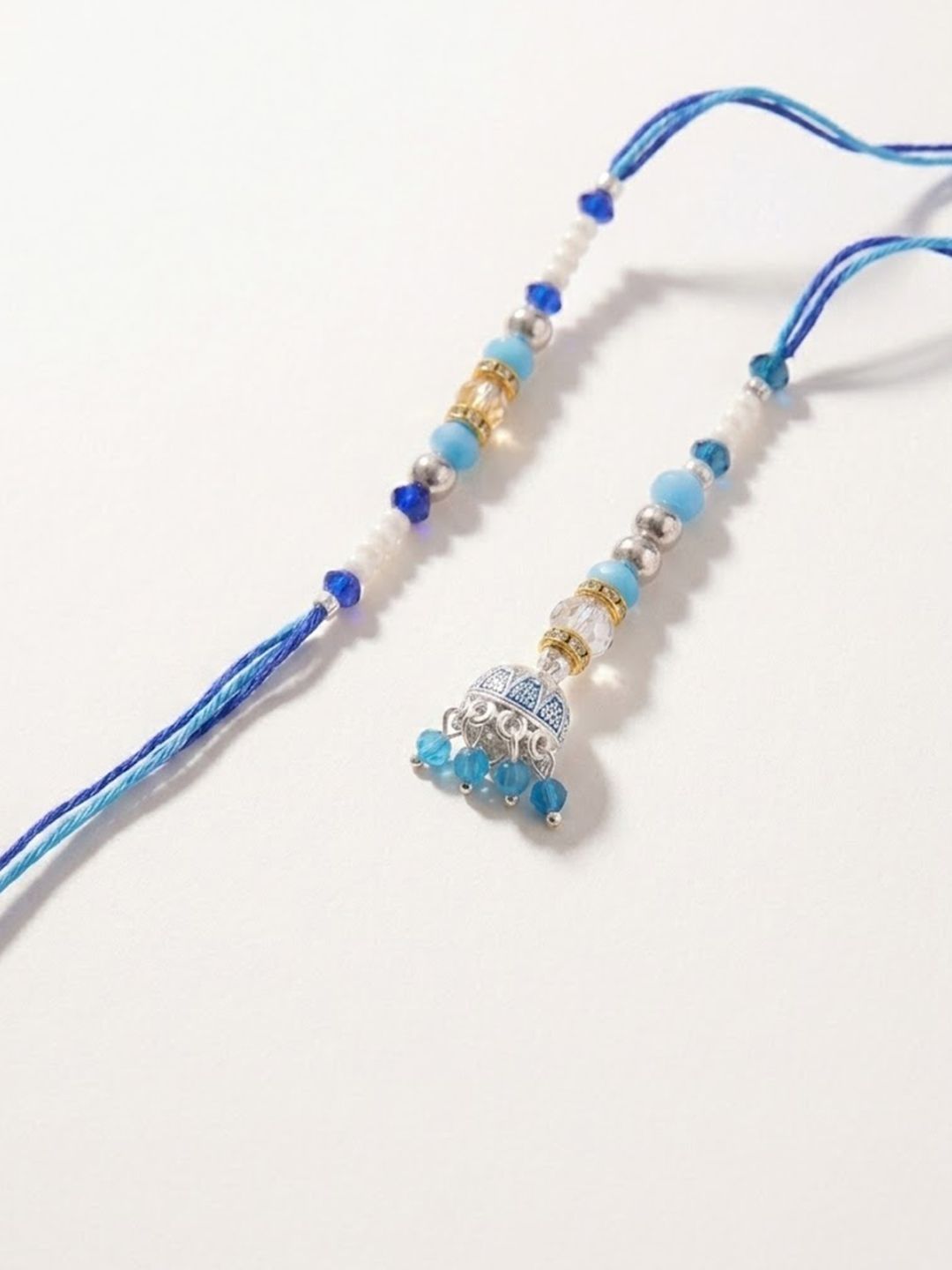 Dhiyona Set Of 2 Blue Artificial Beads Jhumka Design Bhaiya Bhabhi Rakhi With Roli Chawal