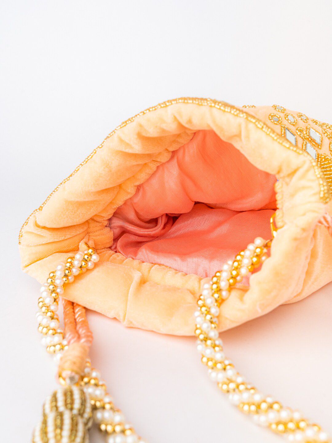 Dhiyona NR Women Peach-Coloured & Gold-Toned Embroidered Potli Clutch