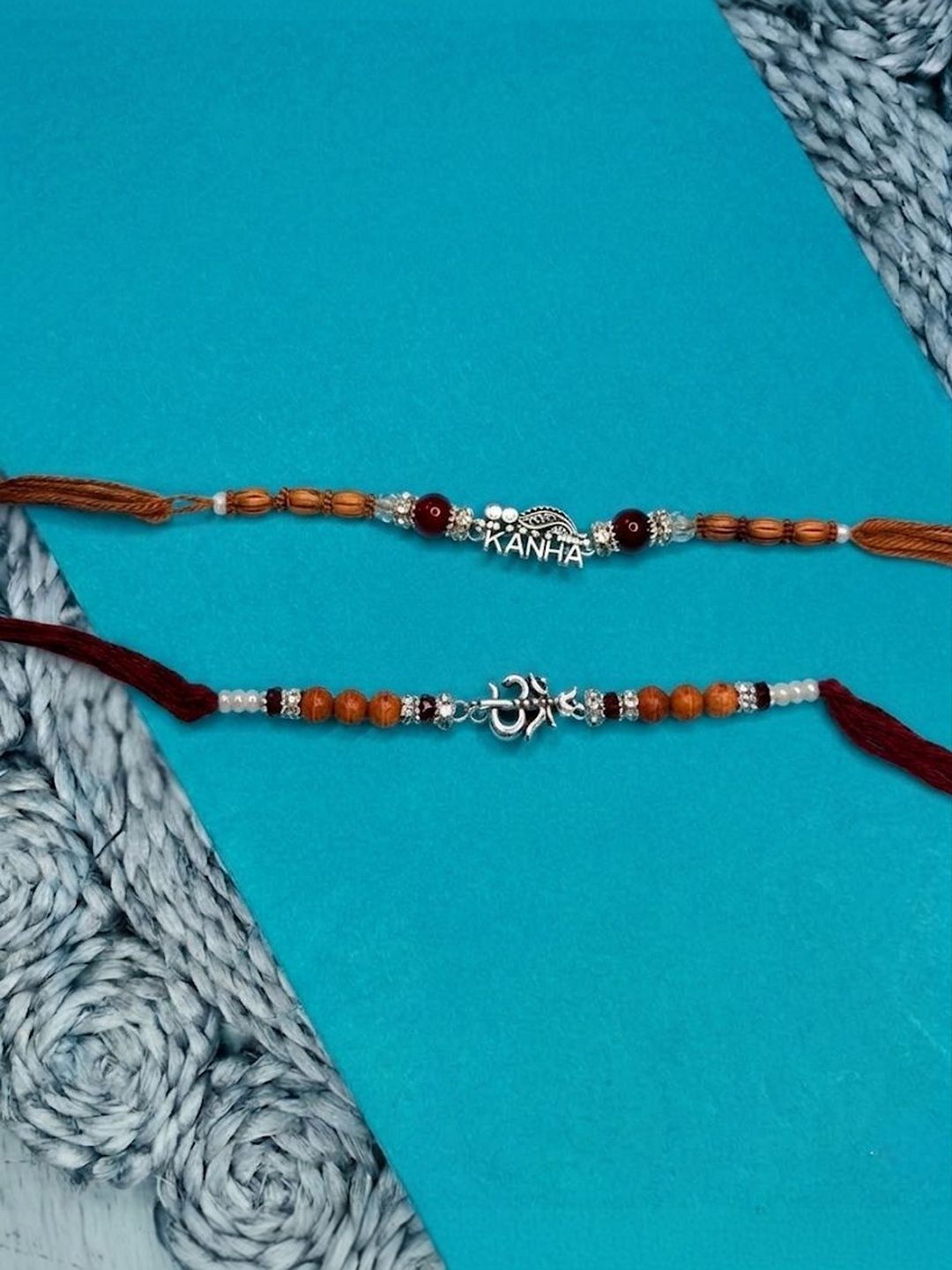 Dhiyona Set Of 2 Silver Toned Religious Rakhi Thread Rakhi Roli Chawal Chandan Mishri