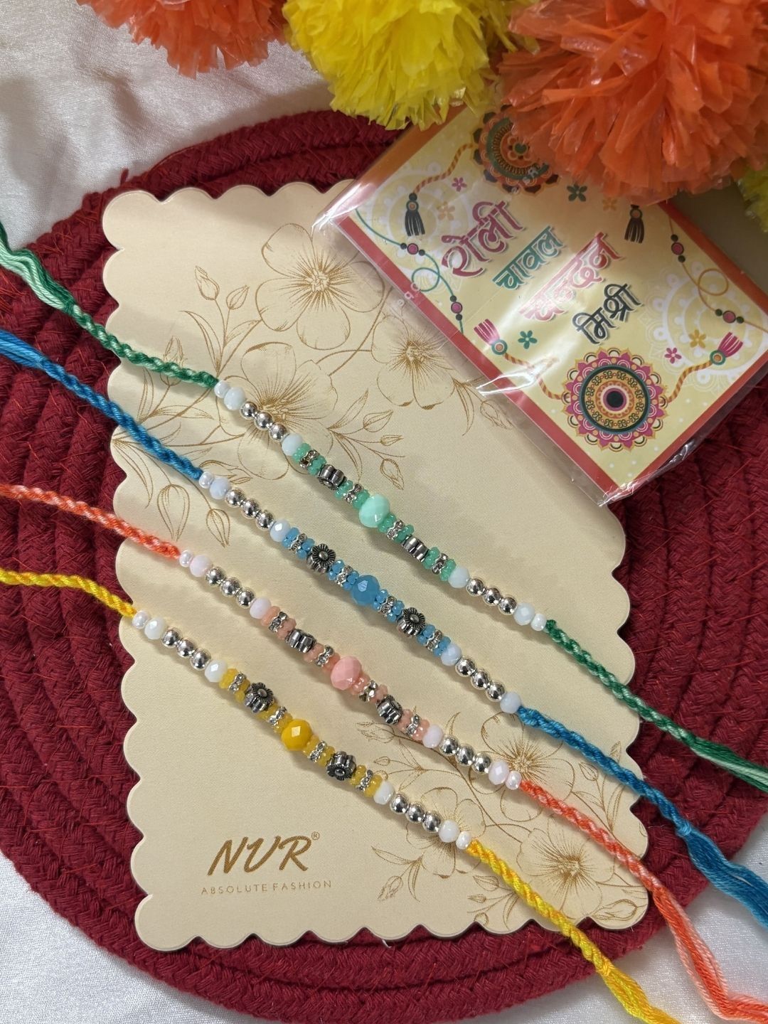 Dhiyona Set Of 4 Multicolor Artificial Beads Thread Rakhi With Roli Chawal Chandan Mishri
