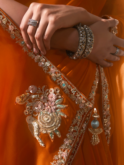 Dhiyona KM Women Orange Saree: Effortless Elegance For Every Occasion