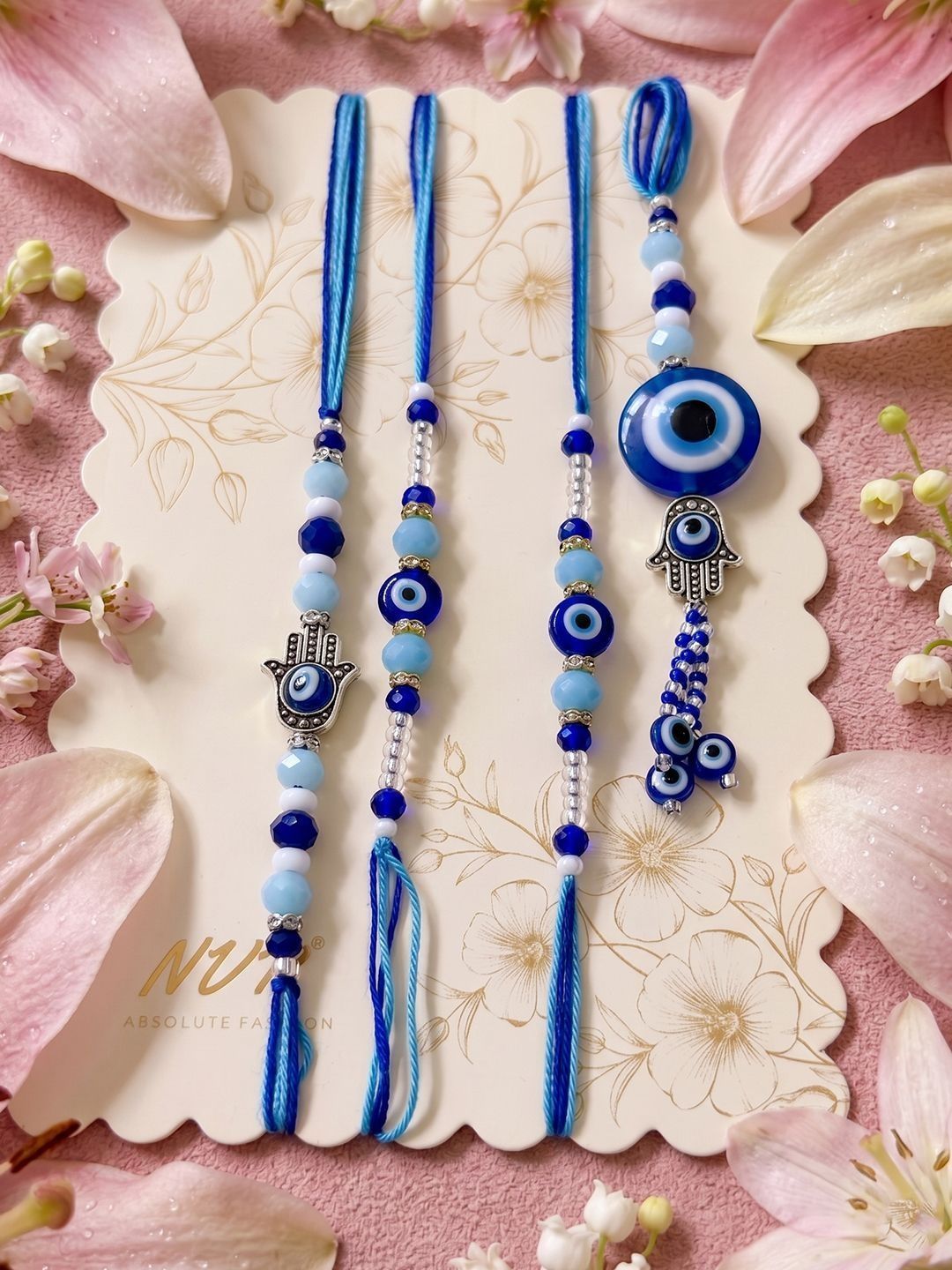 Dhiyona Set Of 4 Designer Blue Evil Eye Thread Rakhi With Roli Chawal Chandan Mishri