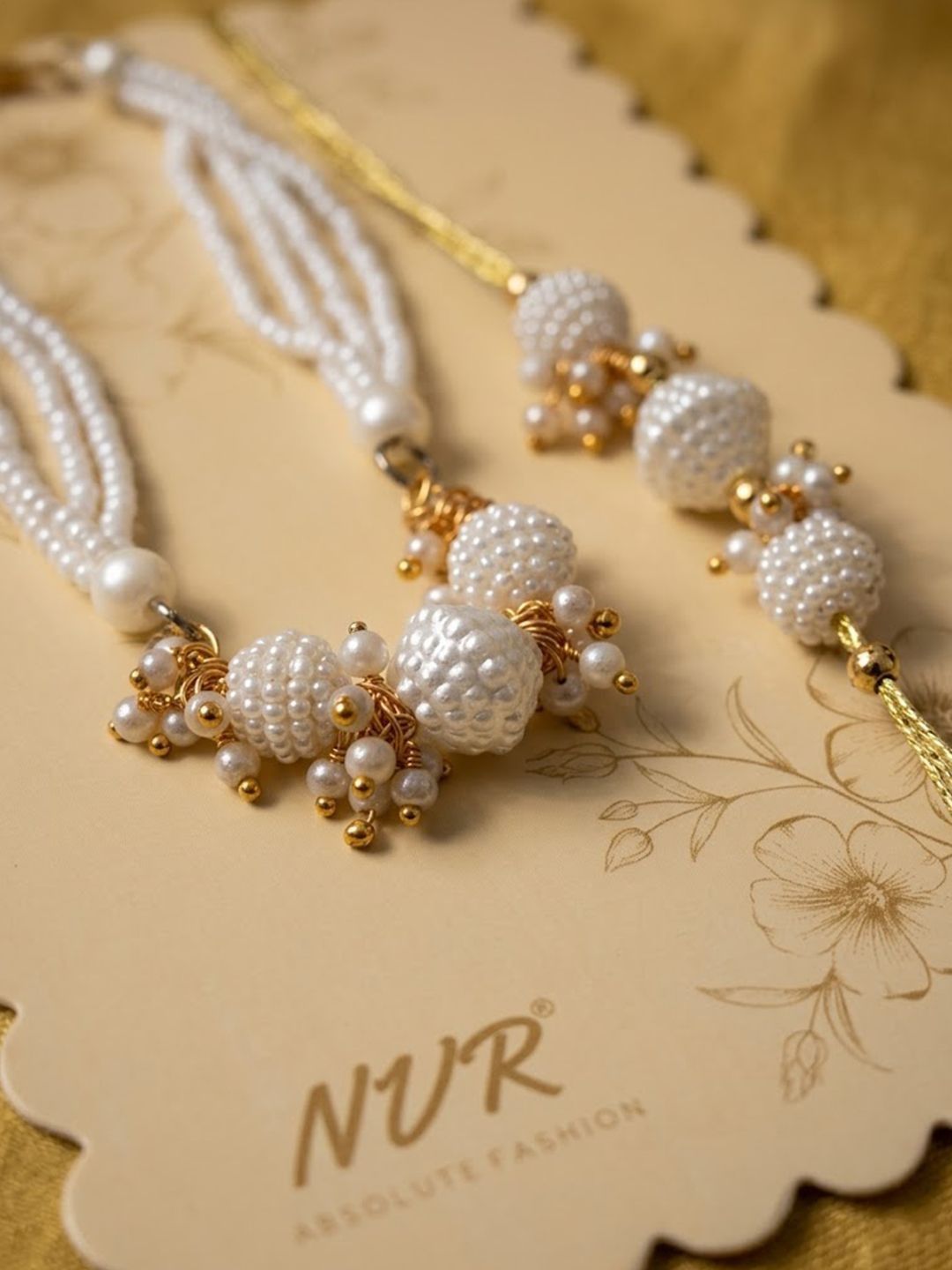 Dhiyona Set Of 2 Gold Toned & White Pearls Bhaiya Bhabhi Rakhi