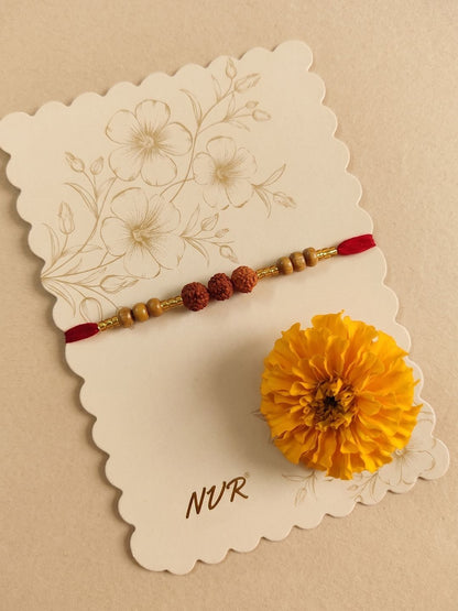 Dhiyona Religious Rudraksh & Red Thread Rakhi With Roli Chawal Chandan Mishri