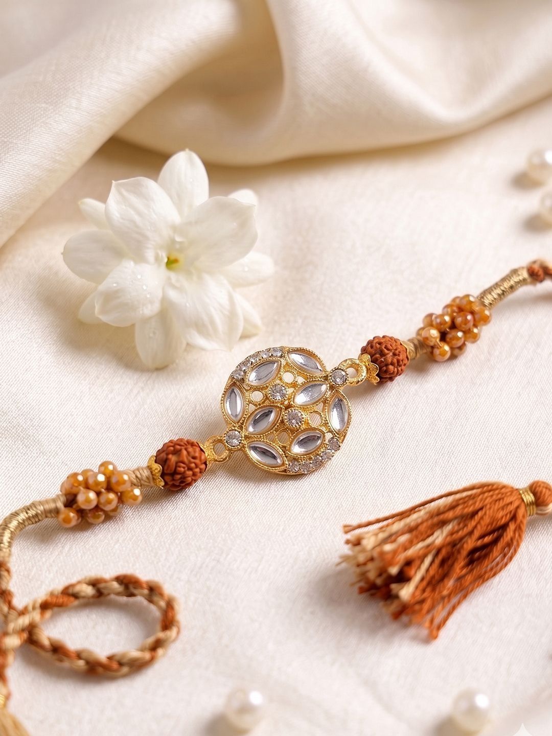 Dhiyona Rudraksh & Kundan Studded Gold Toned Thread Rakhi With Roli Chawal Chandan Mishri