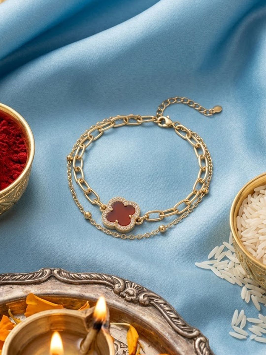 Dhiyona Women Artrificial Stones Gold Plated Rakhi With Roli Chawal Chandan Mishri