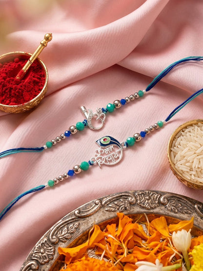 Dhiyona Set Of 2 Silver Toned Beaded Religious Thread Rakhi With Roli Chawal Chandan Mishri