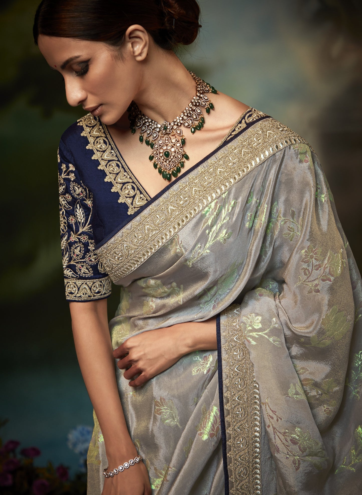 Dhiyona KM Women Pastel Grey Silk Saree With Floral Zari Work And Royal Blue Embroidered Blouse “ Kimora