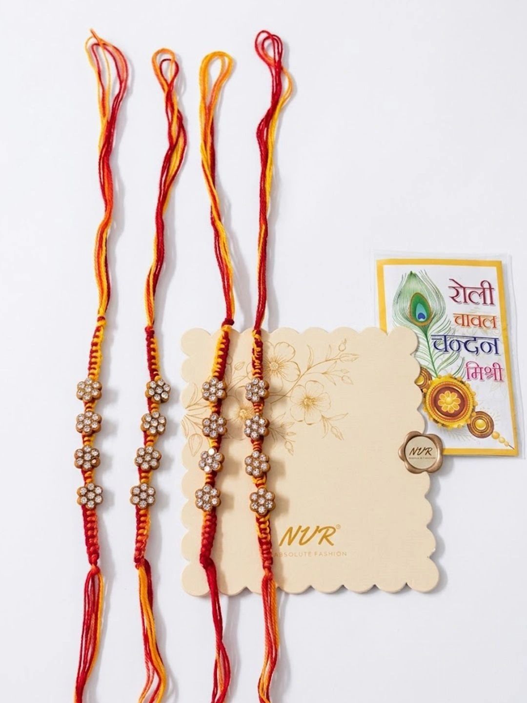 Dhiyona Set Of 4 Artificial Stones Floral Design Thread Rakhi