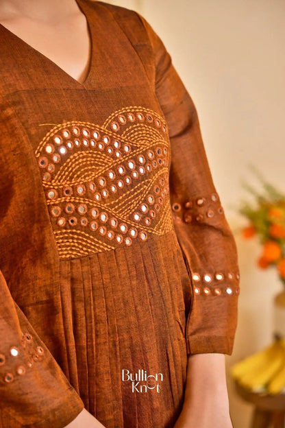 Side view of Saanchi Kurta Set in Peacock Blue, highlighting the pleated design and gold-bordered hem. A must-have traditional outfit from bullionknot.