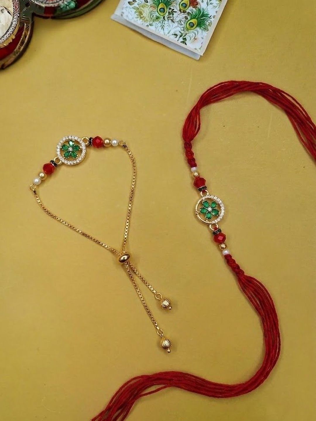 Dhiyona Set Of 2 Ad Drawstring Bhaiya Bhabhi Rakhi With Roli Chawal Chandan Mishri