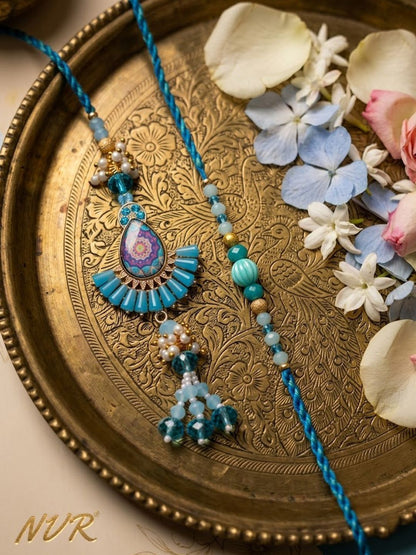 Dhiyona Set Of 2 Transparent Beads Pear Shape Bhaiya Bhabhi Rakhi With Roli Chawal Chandan