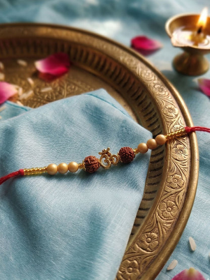 Dhiyona Om Design Rudraksh Thread Rakhi With Roli Chawal Chandan Mishri