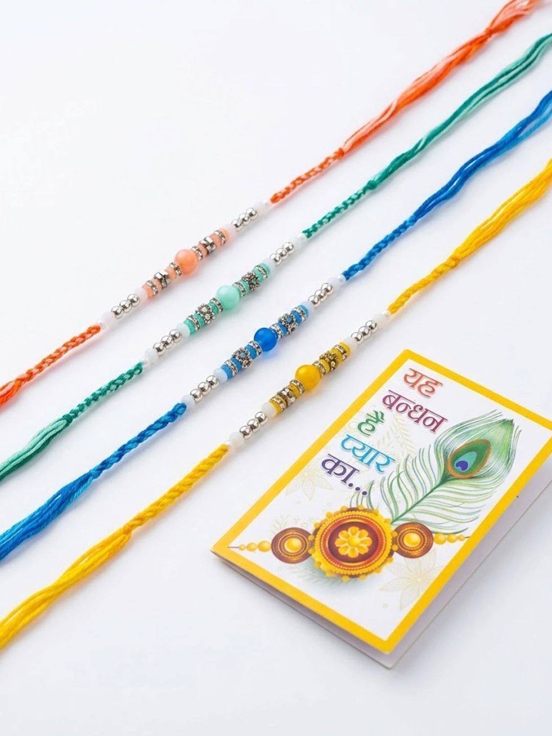 Dhiyona Set Of 4 Multicolor Artificial Beads Thread Rakhi With Roli Chawal Chandan Mishri