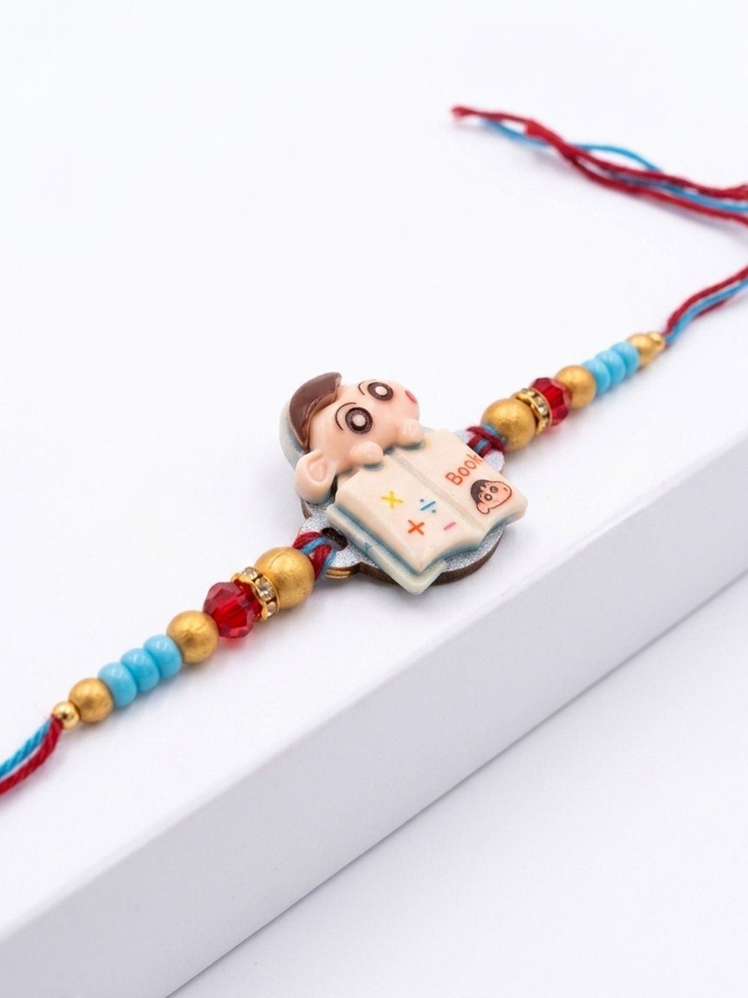 Dhiyona Kids Shinchan Character Artificial Beads Thread Rakhi