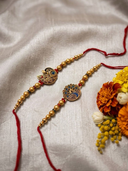 Dhiyona Set Of 2 Peacock & Ghungroo Design Multicolor Thread Rakhi With Roli Chawal Chandan