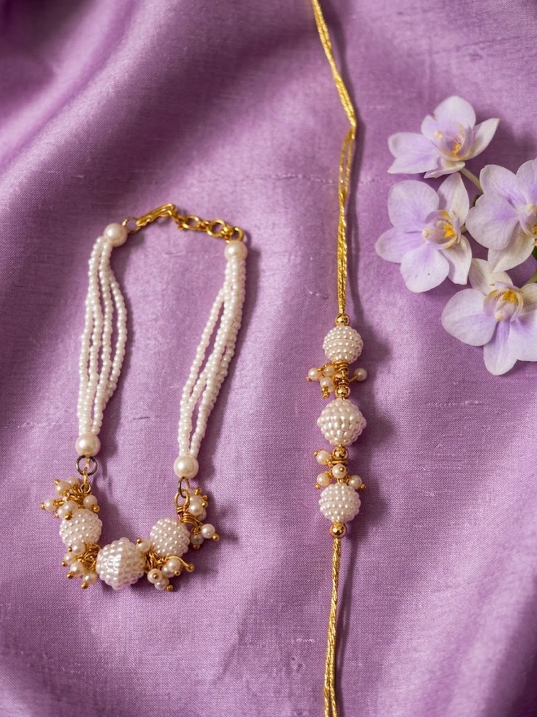 Dhiyona Set Of 2 Gold Toned & White Pearls Bhaiya Bhabhi Rakhi