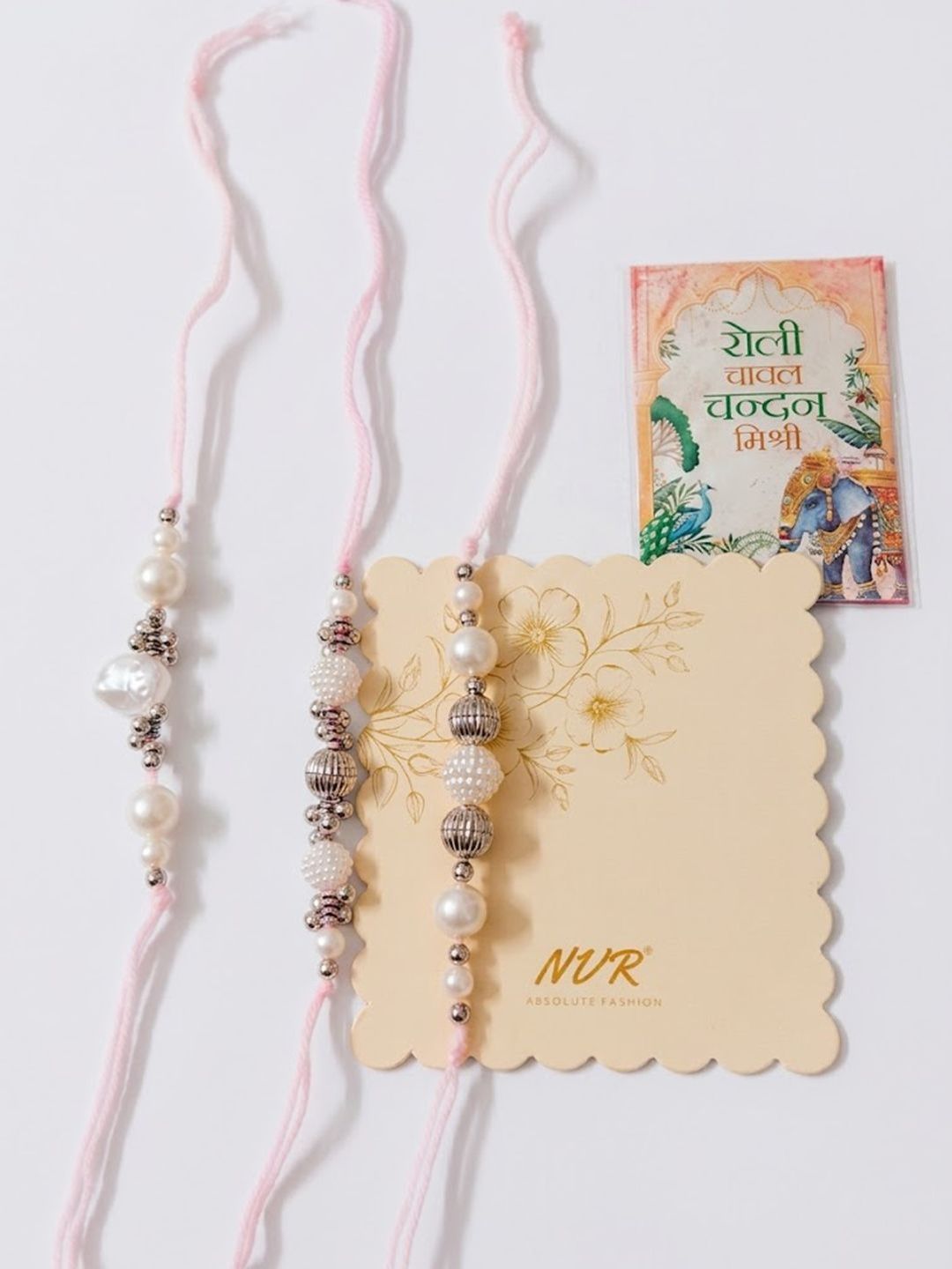 Dhiyona Set Of 3 White Pearls Thread Rakhi With Roli Chawal Chandan Mishri