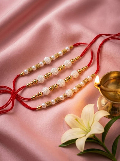 Dhiyona Set Of 4 White Pearls & Red Thread Rakhi With Roli Chawal Chandan Mishri