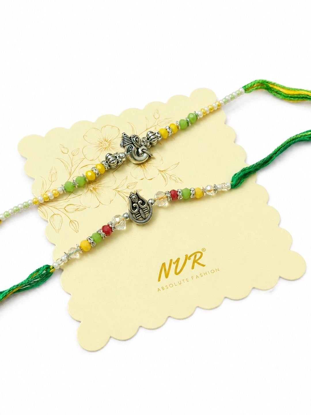 Dhiyona Set Of 2 Multicolor Religious Thread Rakhi With Roli Chawal Chandan Mishri