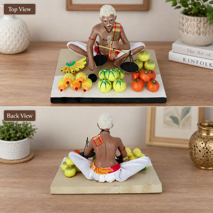 Niharika Collections Krishnanagar Handmade Clay Fruit Seller Idol, Sitting Human Figure Miniature,Hand-Painted Indian Art, Multicolour Home Décor,Golu Display & Gifting-15.2 x 10.2 x 10.2 cm
