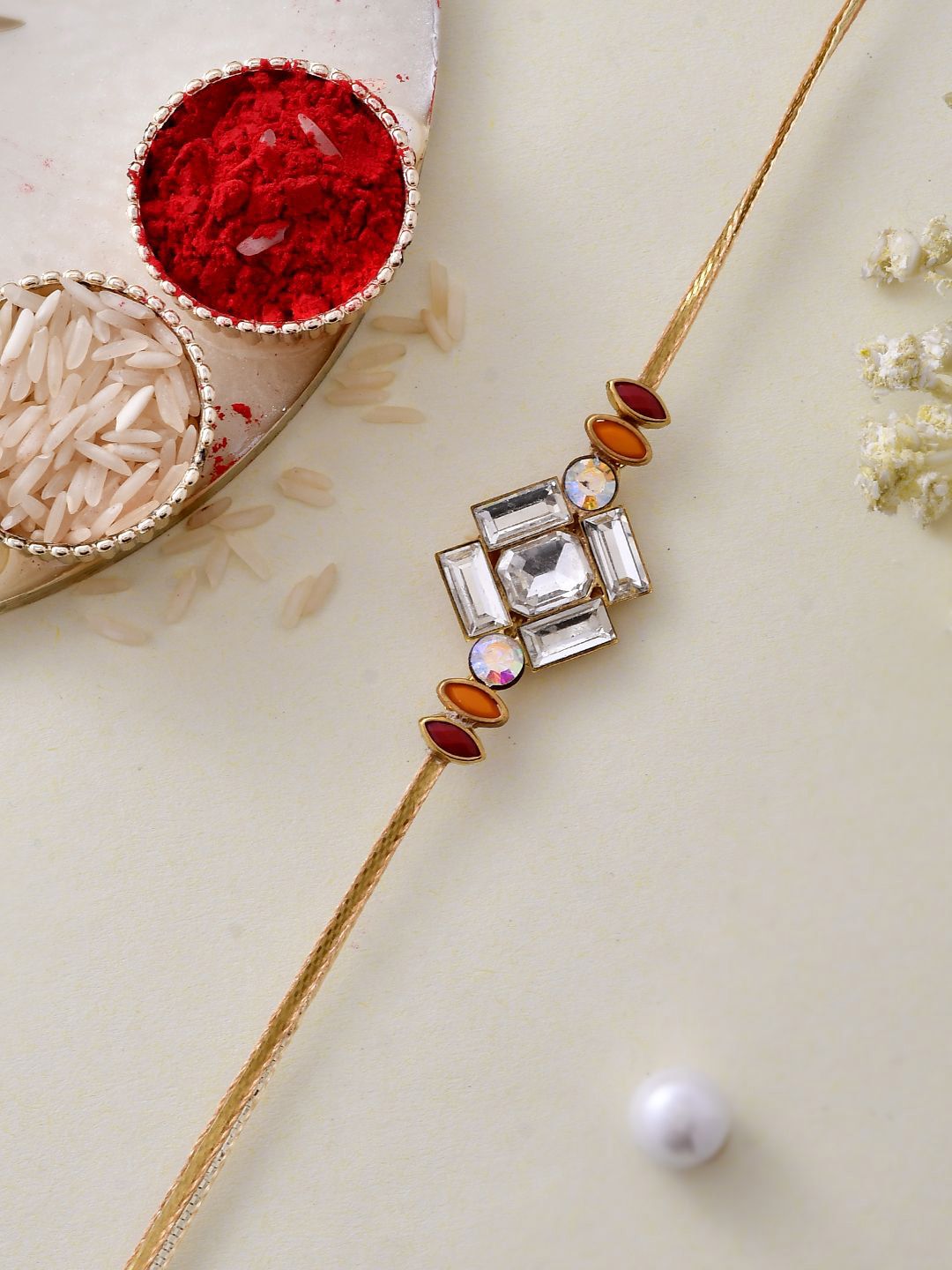 Dhiyona Gold Toned American Diamond Stone Studded Rakhi With Roli Chawal & Greeting Card