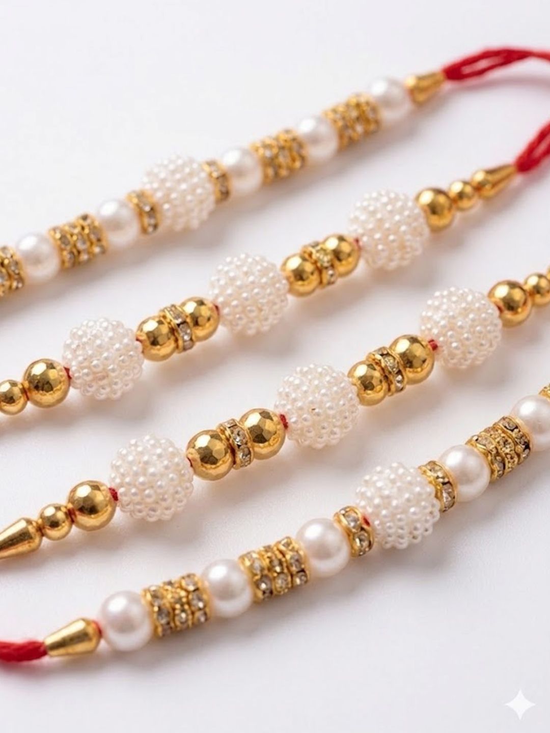Dhiyona Set Of 4 White Pearls & Red Thread Rakhi With Roli Chawal Chandan Mishri