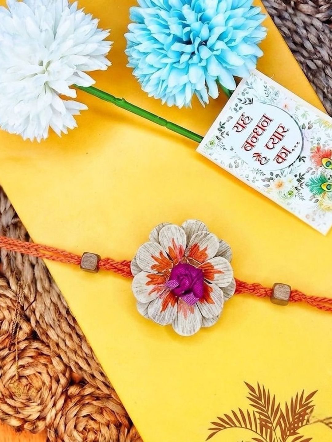 Dhiyona Multicolor Floral Design Plant Seed Rakhi With Roli Chawal Chandan Mishri