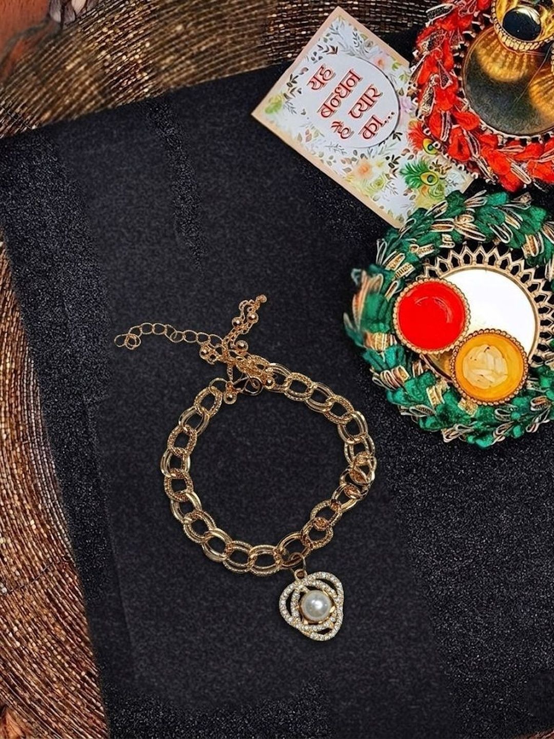 Dhiyona Women Gold Plated Ad Bracelet Rakhi With Roli Chawal Chandan Mishri