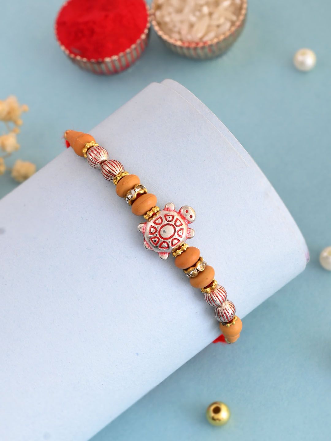 Dhiyona Red Stone Studded & Beaded Tortoise Charm Thread Rakhi With Roli Chawal