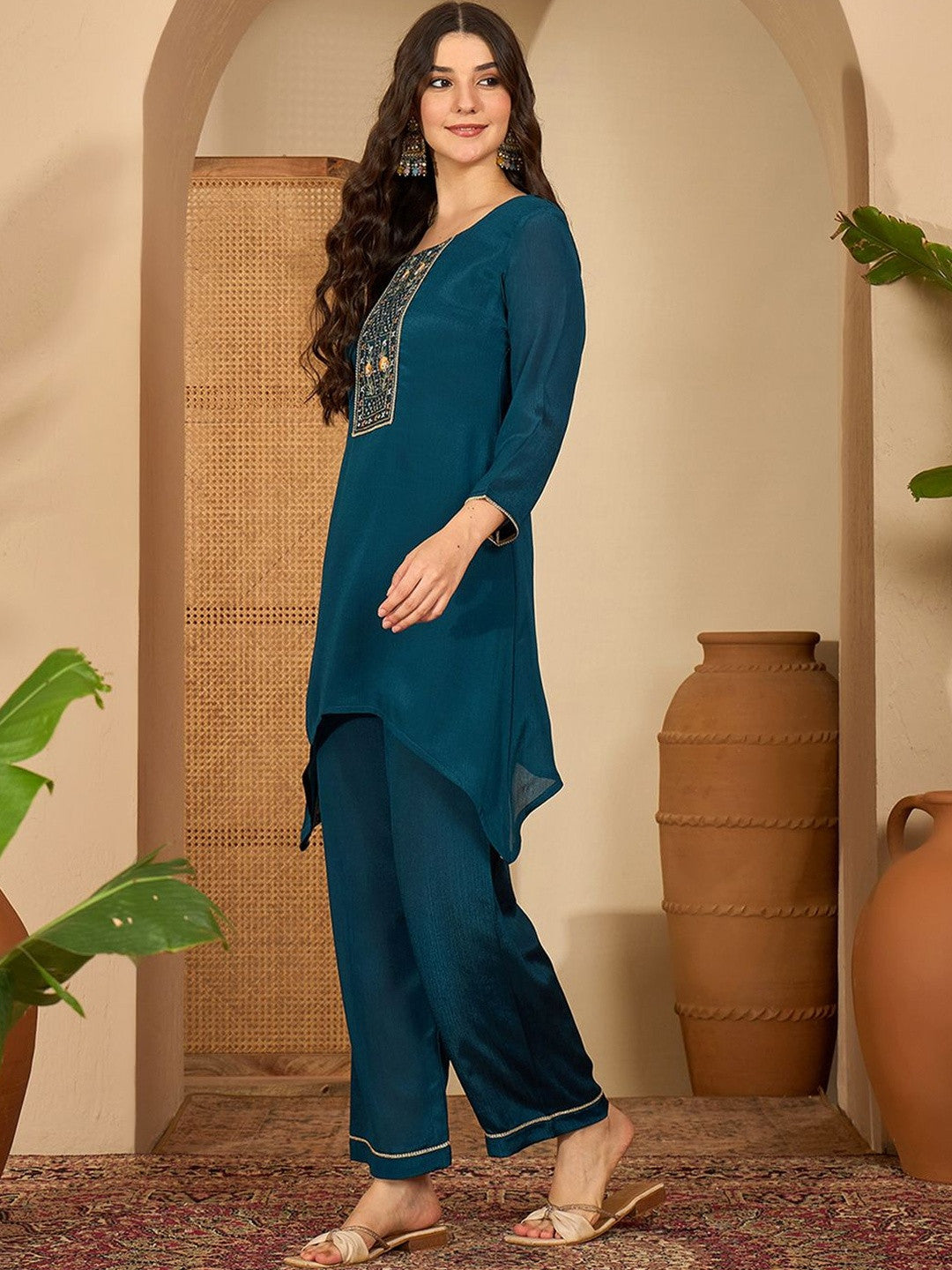 Women Ethnic Motifs Embroidered Asymmetric Sequinned Kurti with Palazzos