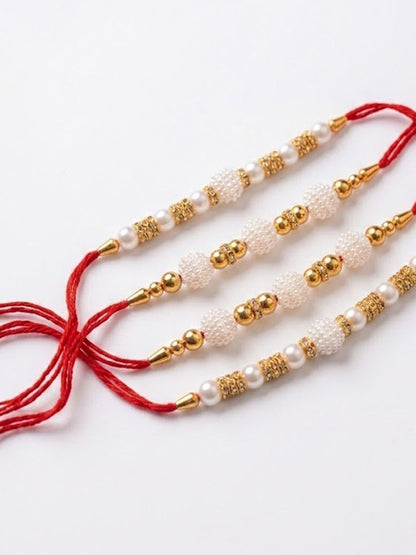 Dhiyona Set Of 4 White Pearls & Red Thread Rakhi With Roli Chawal Chandan Mishri
