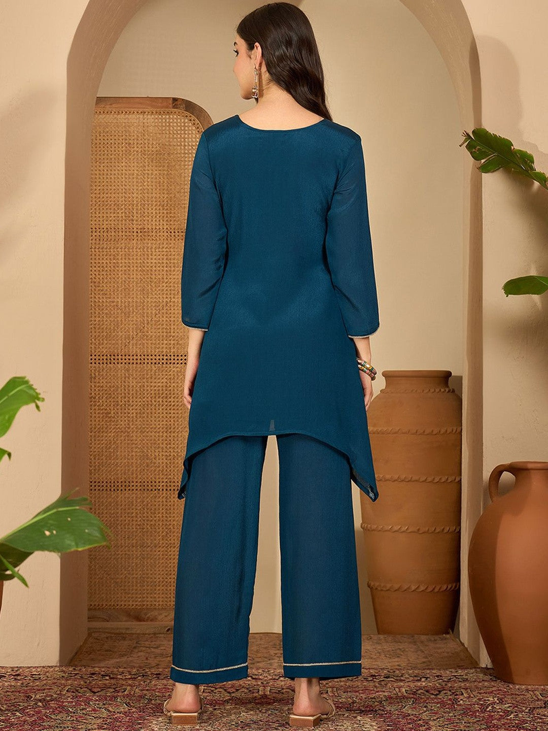Women Ethnic Motifs Embroidered Asymmetric Sequinned Kurti with Palazzos