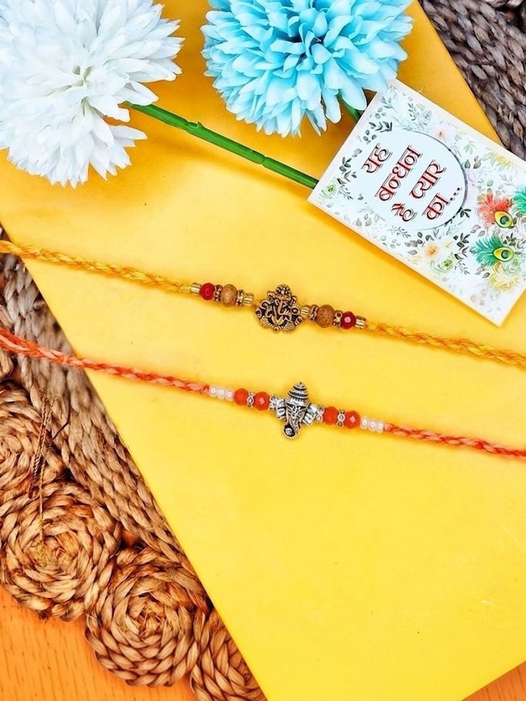 Dhiyona Set Of 2 Multicolor Religious Thread Rakhi With Roli Chawal Chandan Mishri