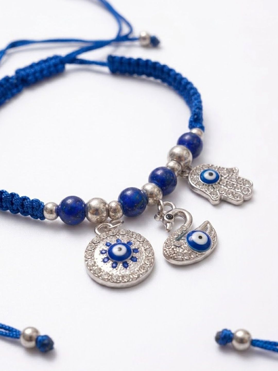 Dhiyona Set Of 2 Blue & Silver Evil Eye Design Bhaiya Bhabhi Rakhi With Roli Chawal Chandan