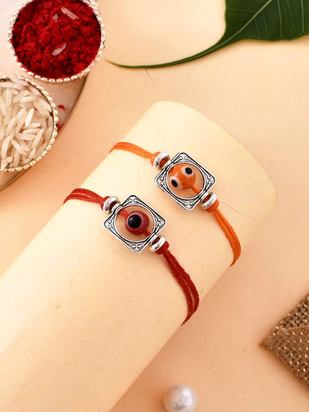 Dhiyona Silver Toned Set Of 2 Beaded Thread Rakhis With Roli Chawal & Greeting Card