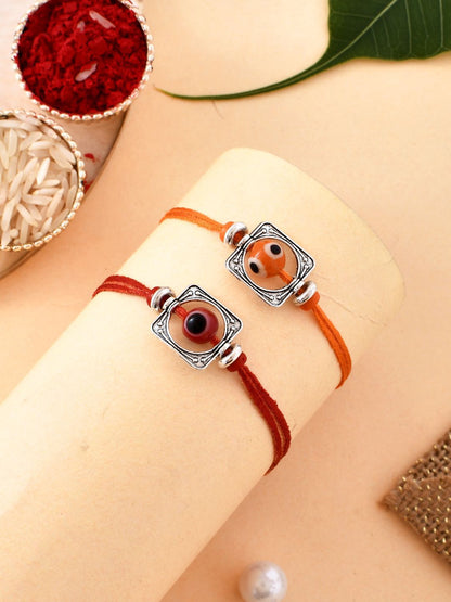 Dhiyona Silver Toned Set Of 2 Beaded Thread Rakhis With Roli Chawal & Greeting Card