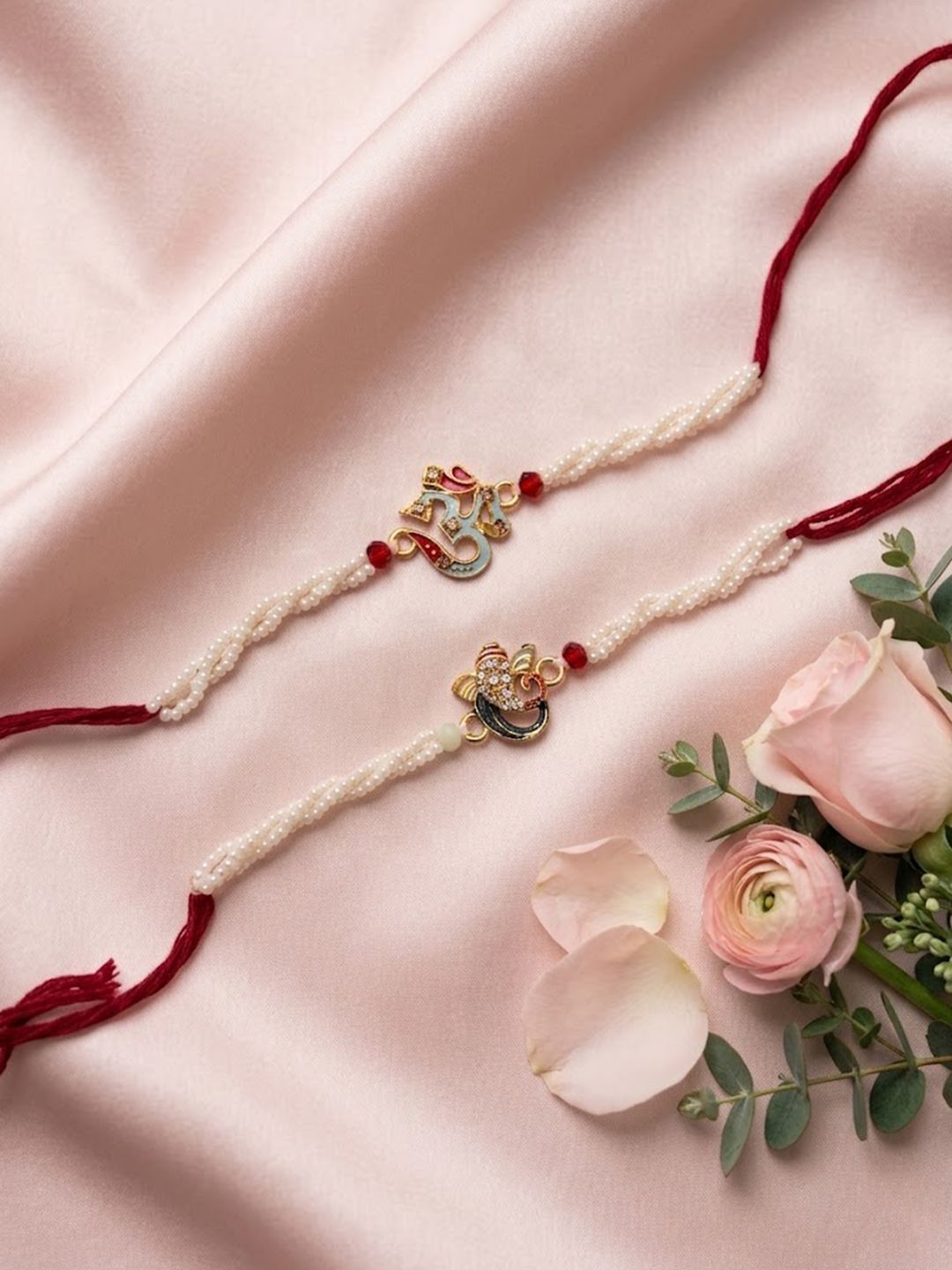 Dhiyona Set Of 2 White Pearls Om & Ganesh Ji Thread Rakhi With Roli Chawal Chandan Mishri