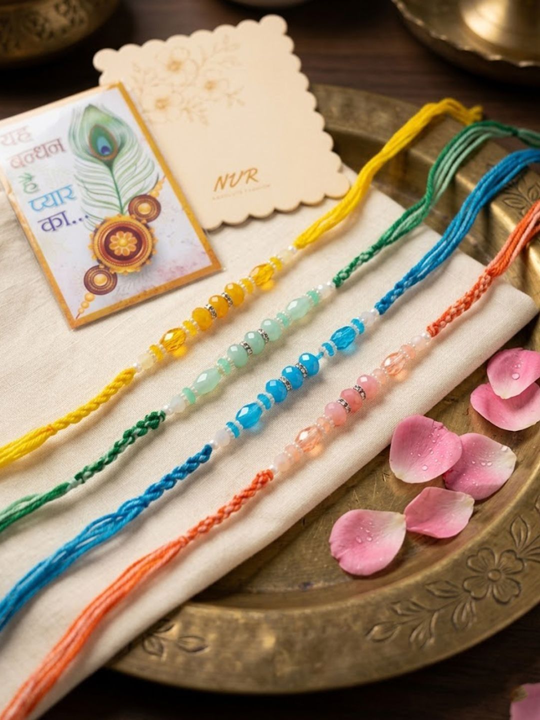 Dhiyona Set Of 4 Multicolor Artificial Beads Thread Rakhi With Roli Chawal Chandan Mishri