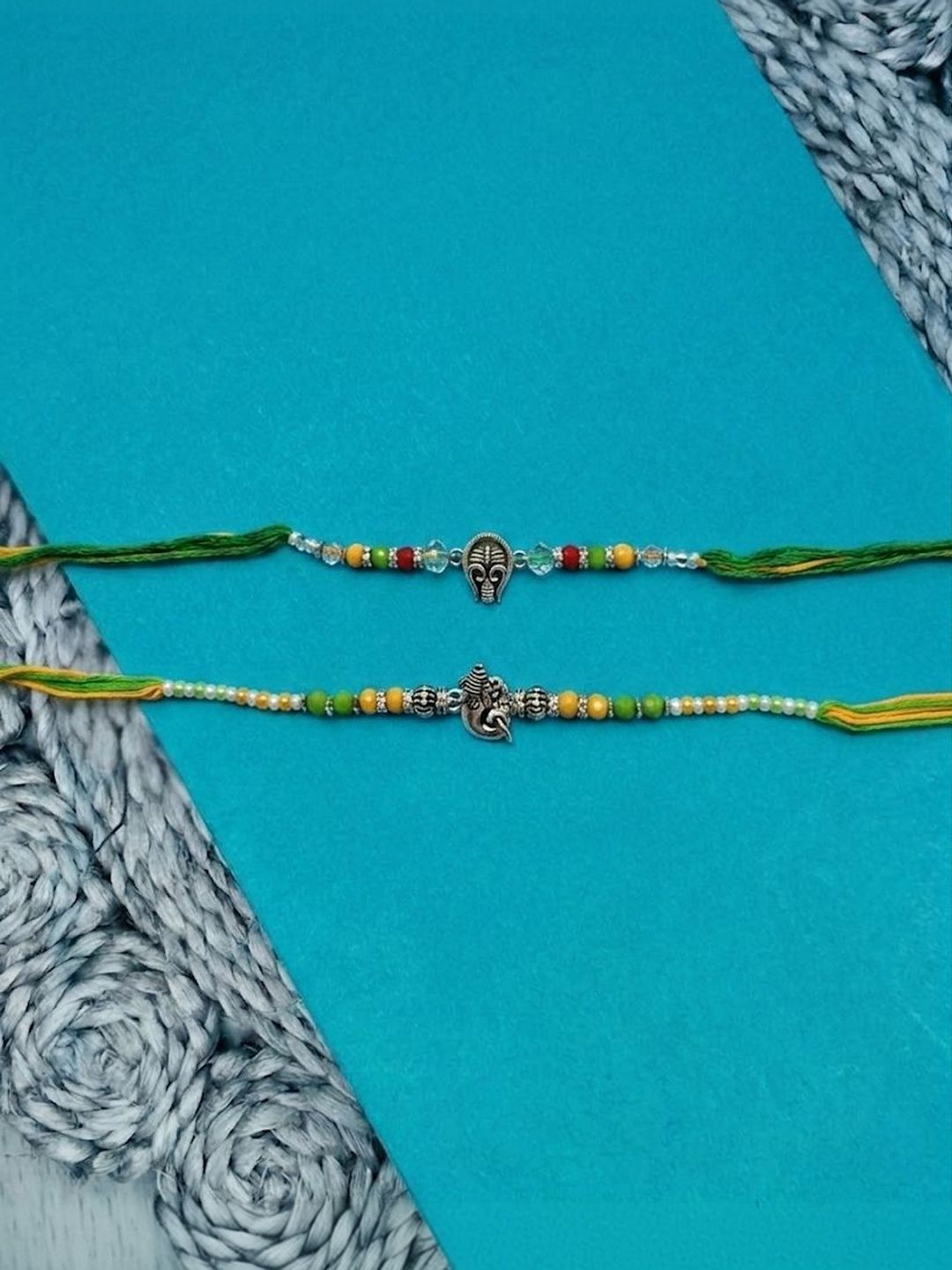 Dhiyona Set Of 2 Multicolor Religious Thread Rakhi With Roli Chawal Chandan Mishri