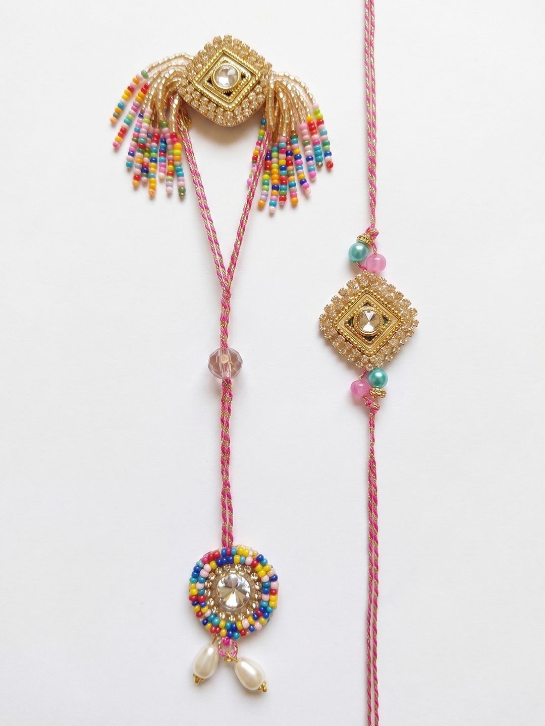 Dhiyona Set Of 2 White Artificial Stones Golden Toned Bhaiya Bhabhi Rakhi With Roli Chawal