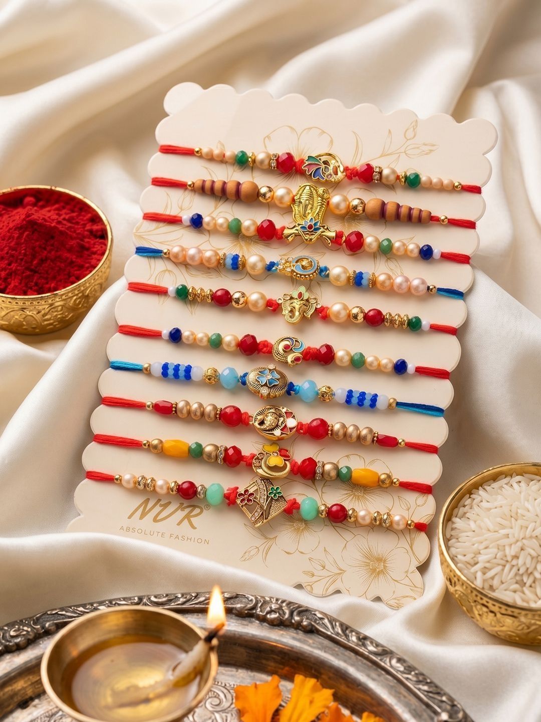 Dhiyona Set Of 10 Artificial Stones & Beads Thread Rakhi With Roli Chawal Chandan Mishri